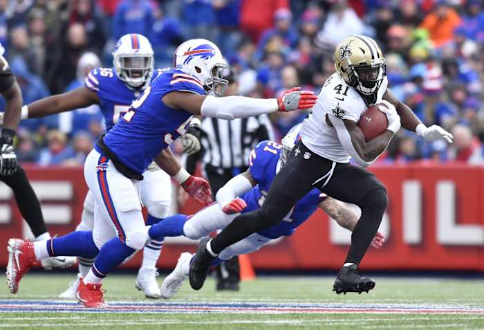 New Orleans Saints running back Alvin Kamara (41) runs past Buffalo linebacker Preston Brown (52). Mandatory Credit: Mark Konezny-USA TODAY Sports